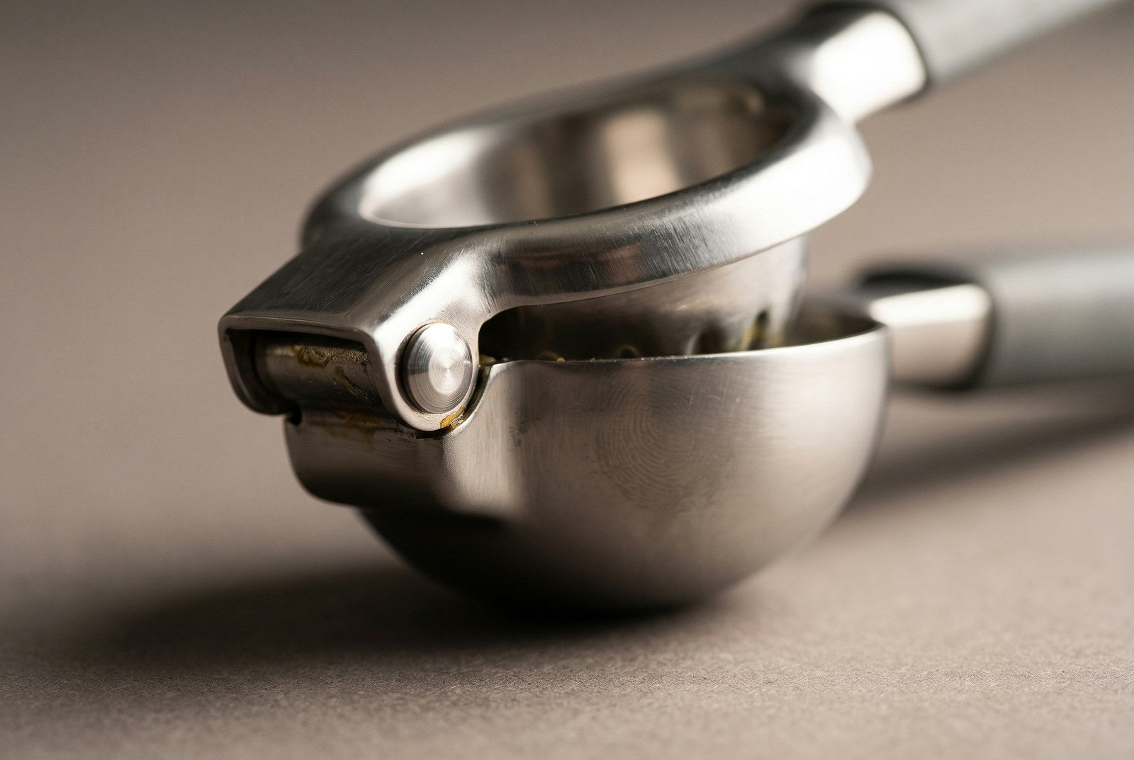 Macro of the reinforced hinge joint on the stainless steel lemon squeezer